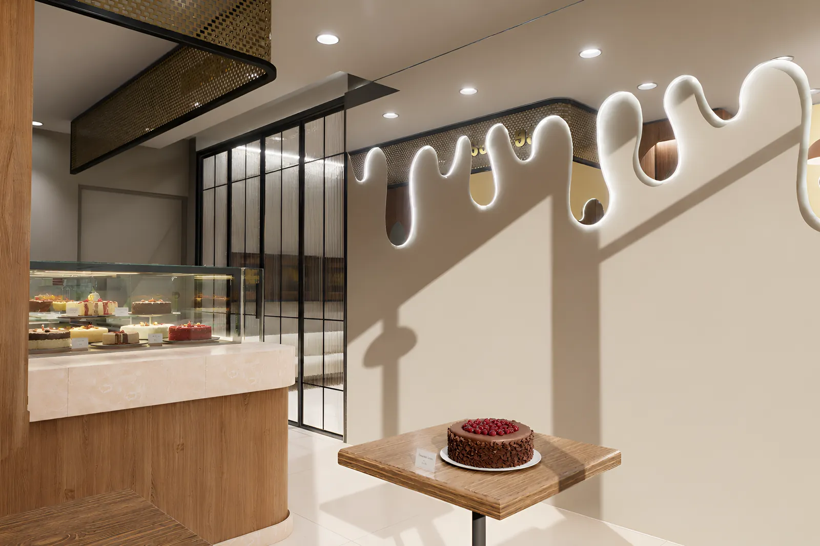 The drip wall in raking daylight, its shadow falling across the plaster, beside the peach marble counter and reeded glass partition